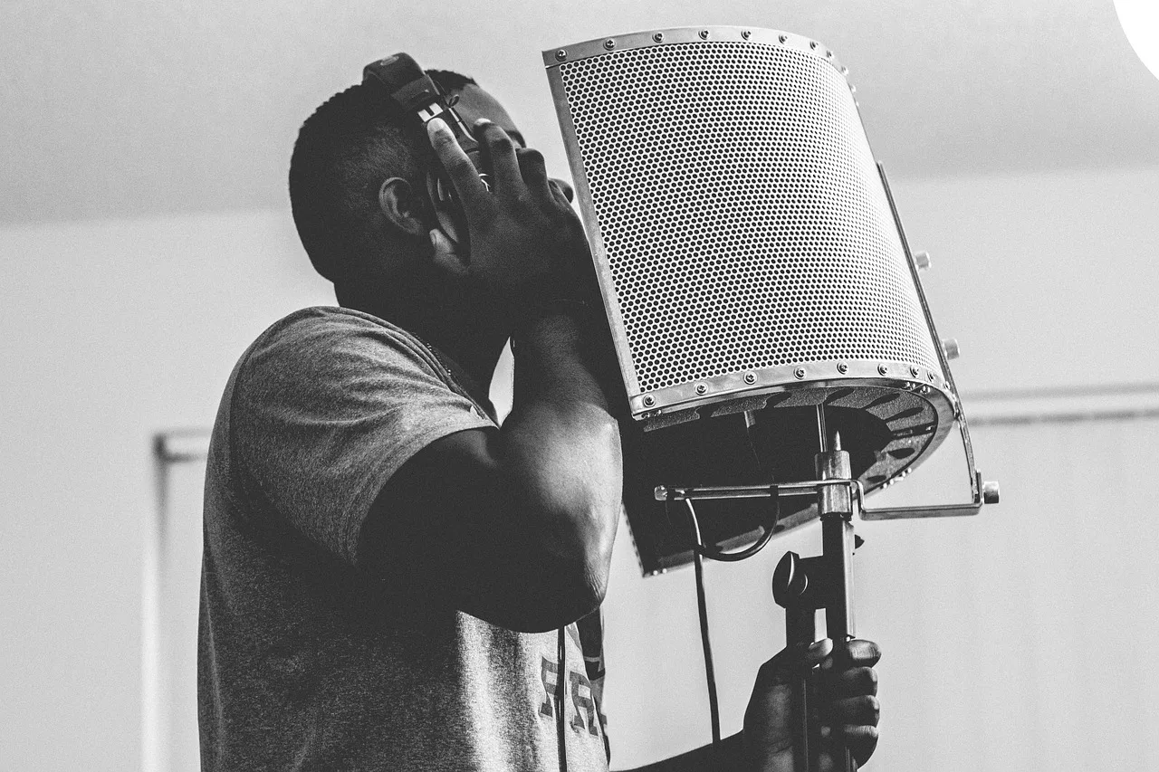 guy, singing, headphone, microphone, studio, music, musical, recording, people, black and white, gray music, gray microphone, gray headphones, singing, singing, singing, singing, singing, microphone, microphone, music. How to grow a voiceover audience that keeps coming back